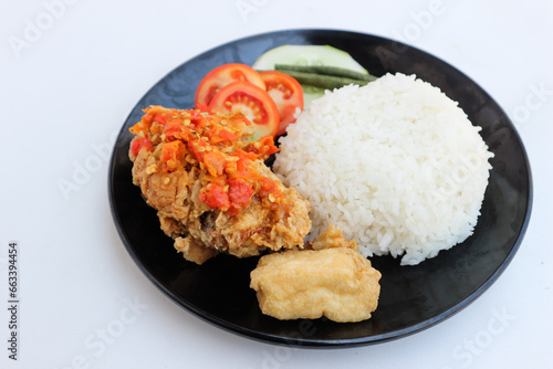 Ayam Geprek Indonesian Food crispy fried chicken with hot and spicy sambal Chili Sauce Served Steam Rice recipe.Currently ayam geprek found in Indonesia and neighbouring countries, Origin Yogyakarta