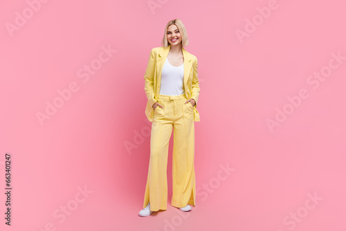 Full length photo of pretty cheerful person put hands pockets posing isolated on pink color background