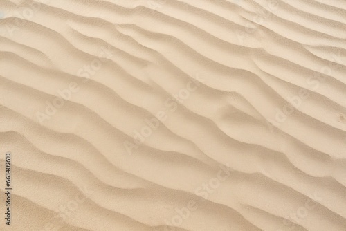 Closeup of sand pattern of a beach in the summer. © MdDin