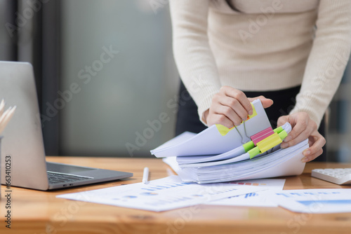 Office woman with document paper at office workspace, Business woman working with stacks paper files.