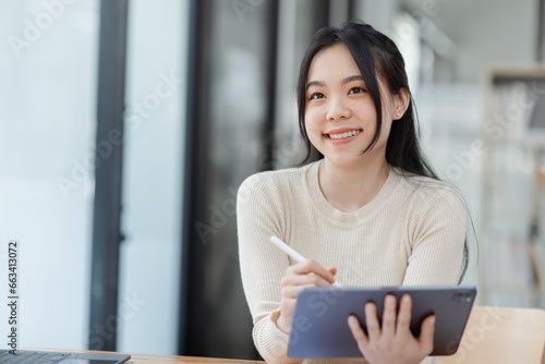 Woman worker feeling excited and euphoric winning, Young woman excited sitting at desk office, Overjoyed woman, Attractive woman triumph sit at desk wit digital tablet win online.