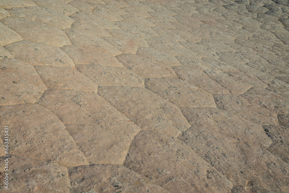 Abstract background texture of unique patterns in a stone surface with geometric patterns. Abstract background texture of unique patterns in a stone surface with geometric patterns.