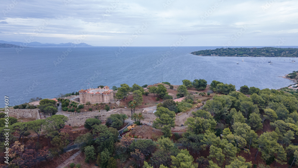 Aerial view of the fort in Saint-Tropez. Photography was shot from a drone at a higher altitude with the bay in the background, on a cloudy day.