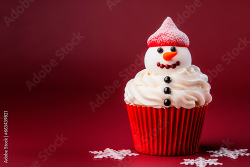 Christmas cupcake with a snowman on a red background. Minimalism.