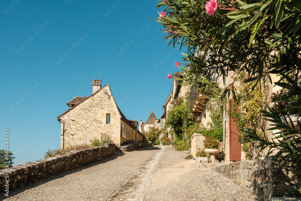 Cobbled street through the village of Beynac-et-Cazenac, one of the most beautiful villages of France, in the Dordogne