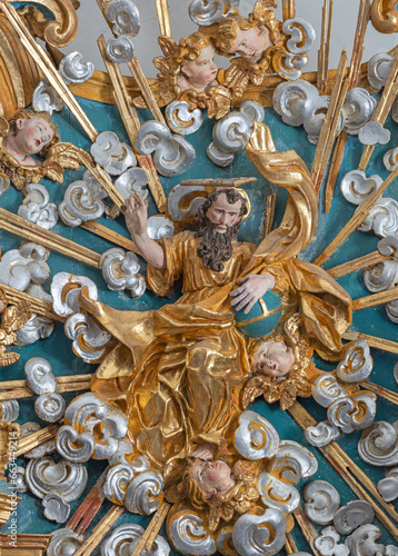 MORGEX, ITALY - JULY 14, 2018: The carved baroque polychrome relief of God the Creator on the main altar of church Chiesa di Santa Maria Assunta from 17. cent.