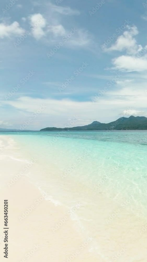 Beautiful inshore waves in Mantigue Island. Camiguin, Philippines. Vertical view. Beautiful inshore waves in Mantigue Island. Camiguin, Philippines. Vertical view.
