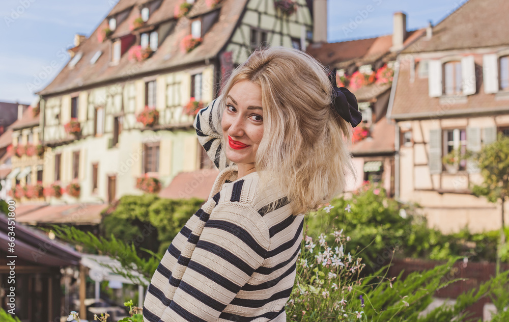 Vacation in France. Traveling and adventure concept. Beautiful European Blonde Woman at town, tourism concept scene