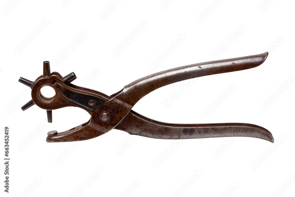 Tailoring accessories. Closeup of a antique adjustable Steel punch pliers or hole punch tool isolated. Clipping path. Tools from tailor, saddler or cobbler. Tailoring accessories. Closeup of a antique adjustable Steel punch pliers or hole punch tool isolated. Clipping path. Tools from tailor, saddler or cobbler.