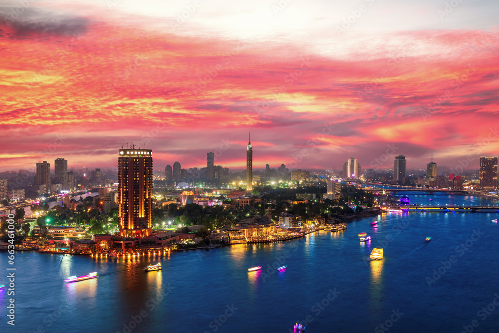Incredible sunset over the Nile and night center of Cairo, Egypt