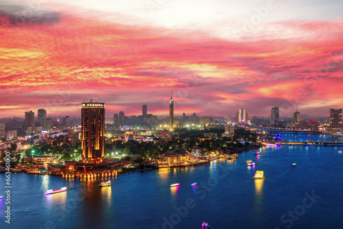 Incredible sunset over the Nile and night center of Cairo, Egypt