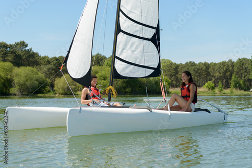 a couple is sailing boat