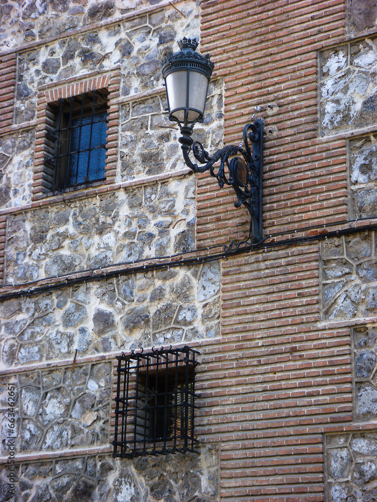 Street retro lamp on the wall of the house. Close-up. Spain.