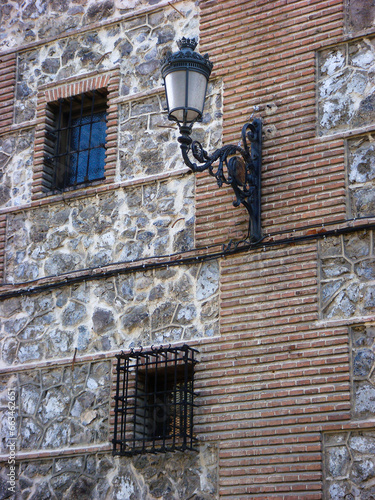 Street retro lamp on the wall of the house. Close-up. Spain.
