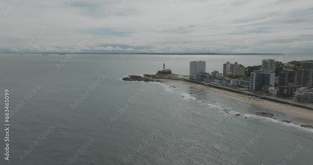 Aerial view of Barra lighthouse at sunset along the coastline in Salvador de Bahia, Bahia, Brazil. Aerial view of Barra lighthouse at sunset along the coastline in Salvador de Bahia, Bahia, Brazil.
