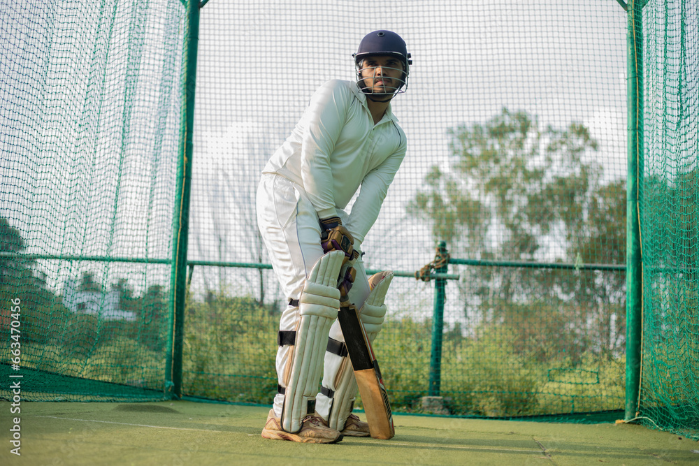 Cricket Batsman waiting bowler to bowl. Player ready to do more practice in nets
