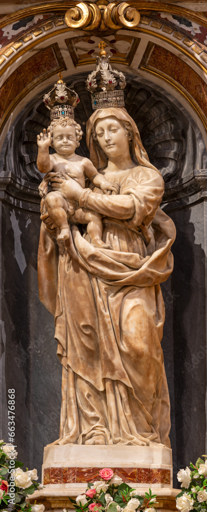 GENOVA, ITALY - MARCH 5, 2023: The marble statue of Madonna in church Basilica di Santa Maria delle Vigne by  Giovanni Battista and Tommaso Orsolino (1616).