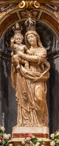GENOVA, ITALY - MARCH 5, 2023: The marble statue of Madonna in church Basilica di Santa Maria delle Vigne by Giovanni Battista and Tommaso Orsolino (1616).