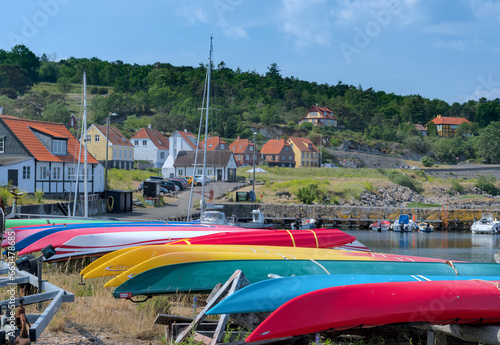 Colorful kayaks on the quay in Bornholm, Gudhjem, Denmark photo