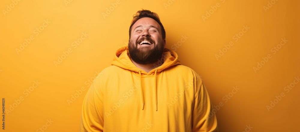 Obraz premium A contented, larger man on a bright background