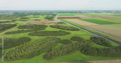 Aerial view of pieces of forest and grassland along farmland in the playfully laid out new nature area Bentwoud, Benthuizen, Zuid-Holland, Netherlands photo