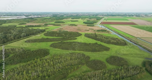 Aerial view of pieces of forest and grassland along farmland in the playfully laid out new nature area Bentwoud, Benthuizen, Zuid-Holland, Netherlands photo