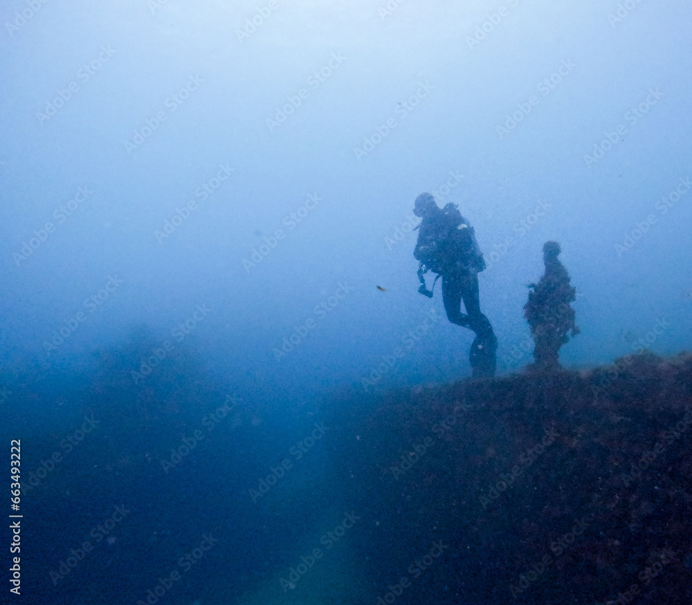 diver on top of a sunken ship diver on top of a sunken ship
