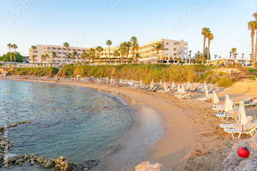 Beautiful beach with white sand located in the tourist region of Paphos, Cyprus. September 2023