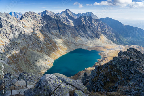Fototapeta Naklejka Na Ścianę i Meble -  View from Kôprovský štít (Tatras, Tatry - Slovakia). Lake (Veľké Hincovo pleso), rocky mountains in autumn. Mordor concept 