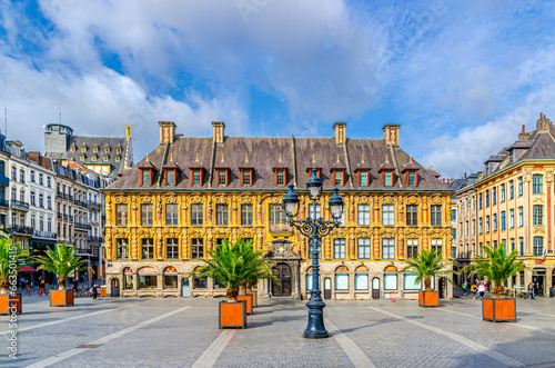 Vieille Bourse Old Stock Exchange flemish mannerist style building, palms trees and street light on Place du Theatre square in Lille historical city center, French Flanders, Nord department, France