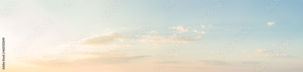 Panoramic sky background. Morning sunlight reflected in the clouds. 