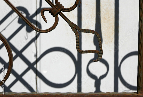 old rusty wrought iron fence