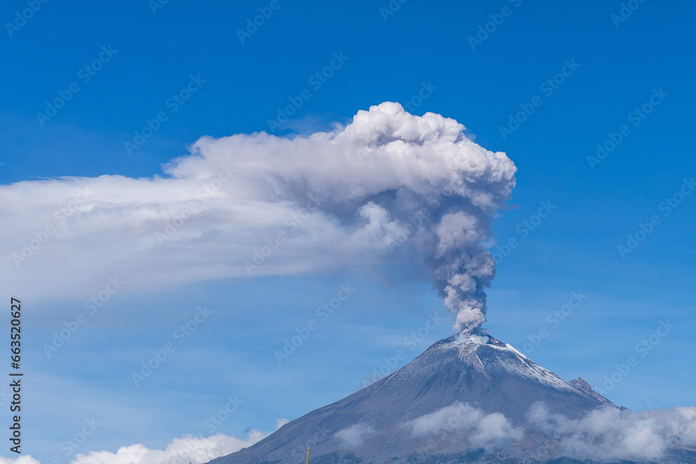 fumarole explosion of popocatepetl volcano with a clear sky