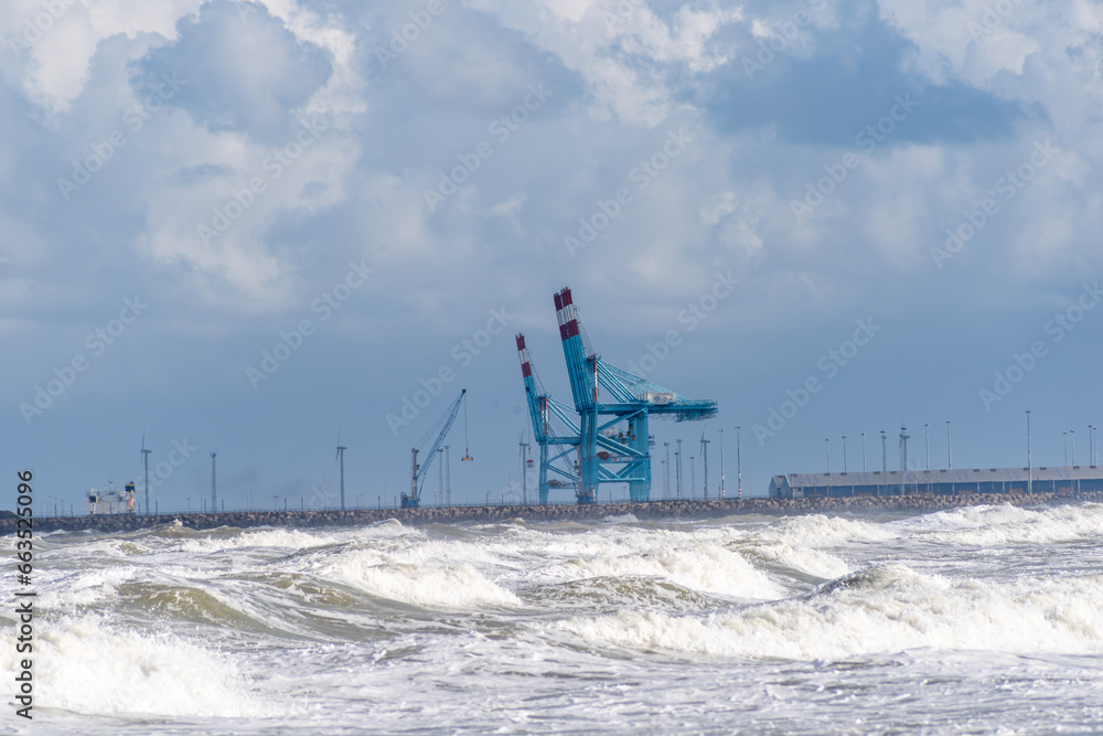 Heavy industry at sea, marine portal, view of the crane over the sea Heavy industry at sea, marine portal, view of the crane over the sea