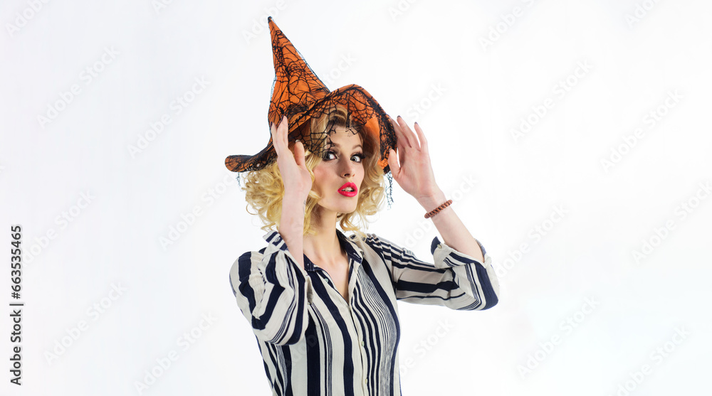 Happy Halloween holiday. Sexy woman in witch hat ready for Haloween party. Female wizard fairy character for All Saints Day. Sorceress girl dressed in carnival costume. Enchantress woman in magic hat.