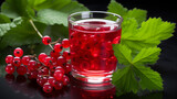 Glass filled with red currant fruits and juice