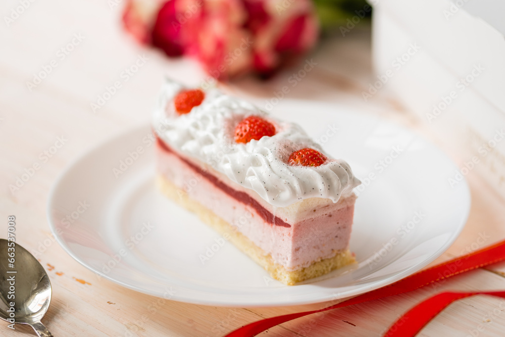 Delicious sweet cake close-up selective focus, cake with white protein cream decorated with strawberries Delicious sweet cake close-up selective focus, cake with white protein cream decorated with strawberries