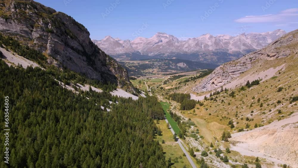 Aerial view of valley and Col du Noyer looking towards mountains of the Devoluy Massif in summer. Hautes-Alpes (Alps), France Aerial view of valley and Col du Noyer looking towards mountains of the Devoluy Massif in summer. Hautes-Alpes (Alps), France