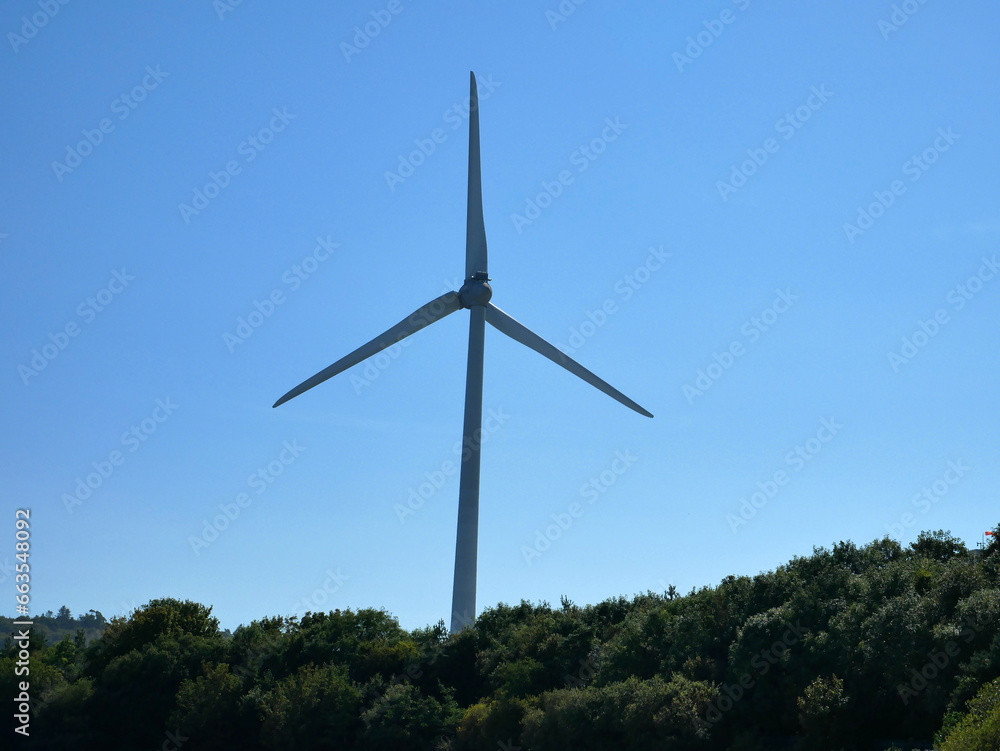 Wind power plant rotor close view. Windpower generator. Green energy, eco friendly industry concept Wind power plant rotor close view. Windpower generator. Green energy, eco friendly industry concept