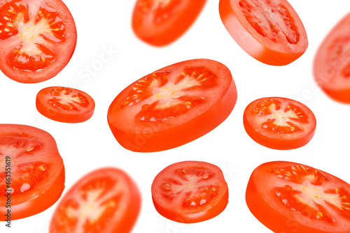 Flying tomatoes cut into circles. Tomatoes, tomatoes, cut, fresh tomatoes. Isolated.Background from tomatoes. Different size.