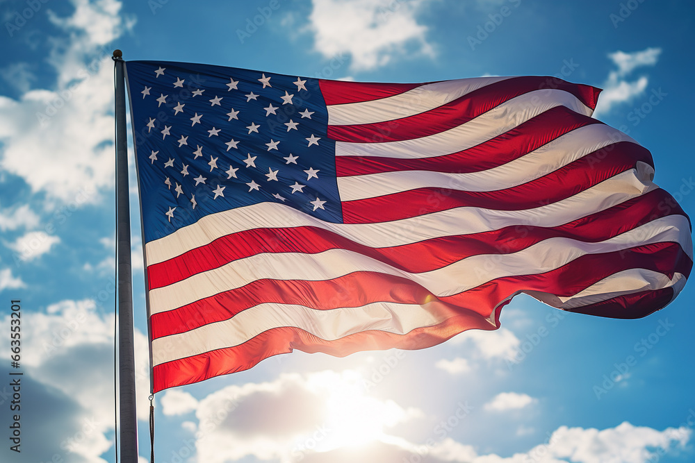 Fototapeta premium USA flag flying on the blue sky