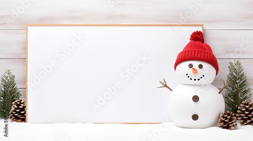 snowman with blank white board for marketing and copy space for messages,  © Muhammad Irfan