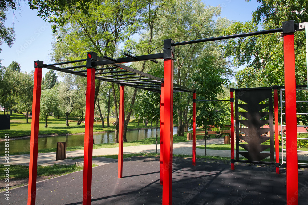 Empty outdoor gym with exercise equipment in park Empty outdoor gym with exercise equipment in park