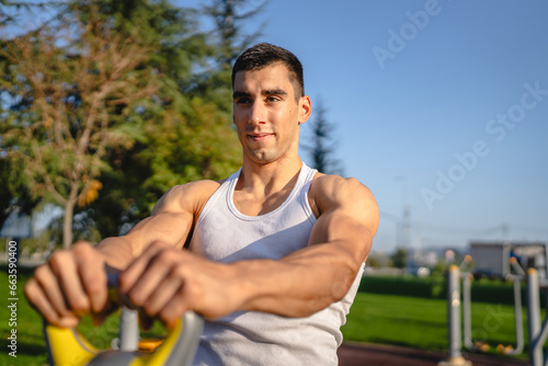 One man young adult caucasian male train with kettlebell girya weight