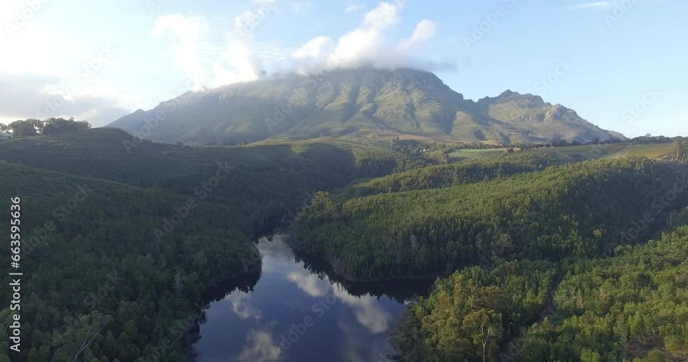 Drone, green and mountain, landscape with dam and water, countryside with environment and nature background. Aerial view, location or destination in South Africa with grass land, lake or river Drone, green and mountain, landscape with dam and water, countryside with environment and nature background. Aerial view, location or destination in South Africa with grass land, lake or river