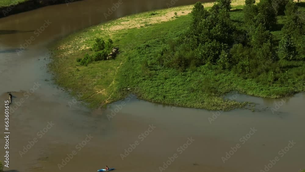 Illinois River With Tourist Rowing A Boat Or Kayak On The Water - drone shot Illinois River With Tourist Rowing A Boat Or Kayak On The Water - drone shot