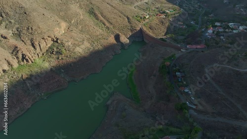 flying over the Ayagaures dam on the island of Gran Canaria on a sunny day and a beautiful natural environment. photo