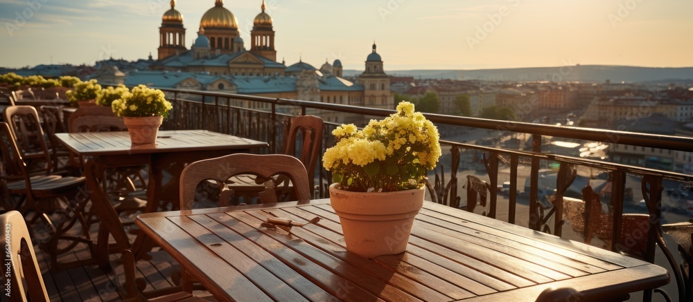 Outdoor terrace with vase of flowers in Prague