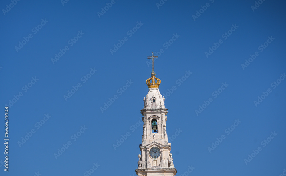 Fatima Church basilica. The miracle place church from Fatima, Portugal, against blue clean sky, while the bells are ringing. Religious landmark monastery from Portugal.