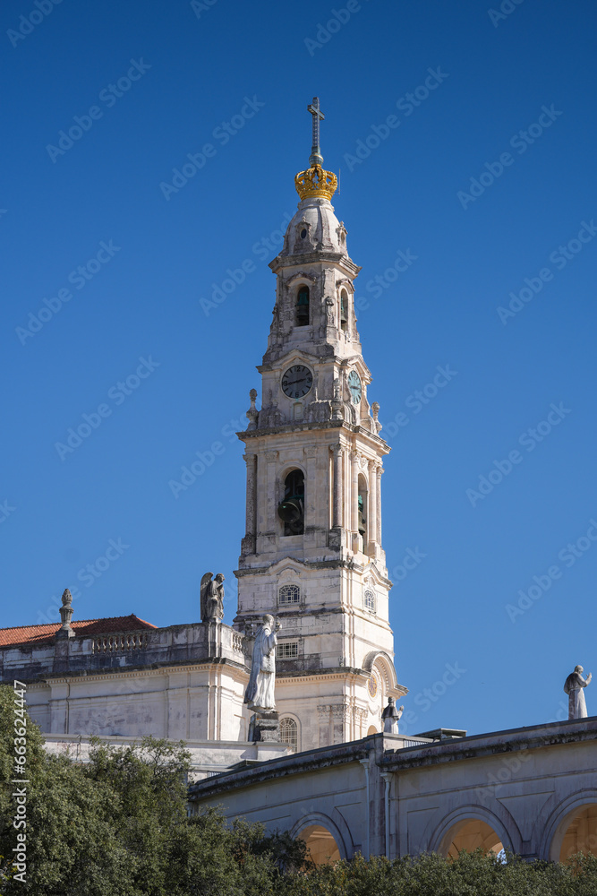 Fatima Church basilica. The miracle place church from Fatima, Portugal, against blue clean sky, while the bells are ringing. Religious landmark monastery from Portugal.